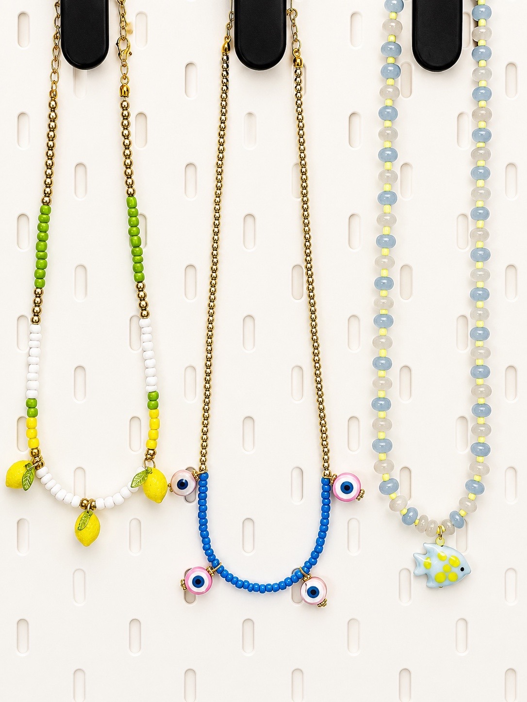 Handmade necklaces arranged in a display tray