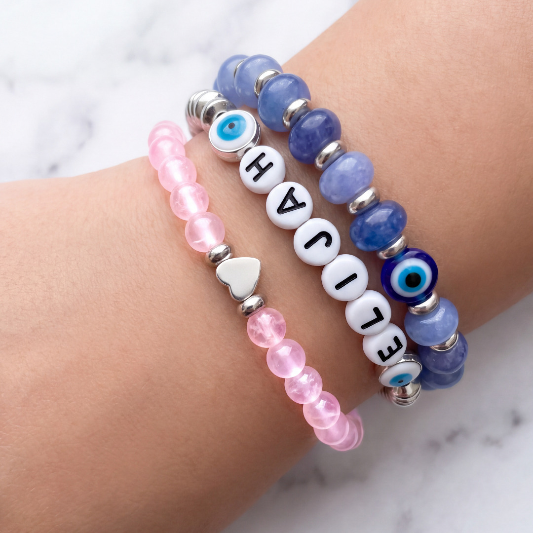 Pink and blue custom bracelets worn together